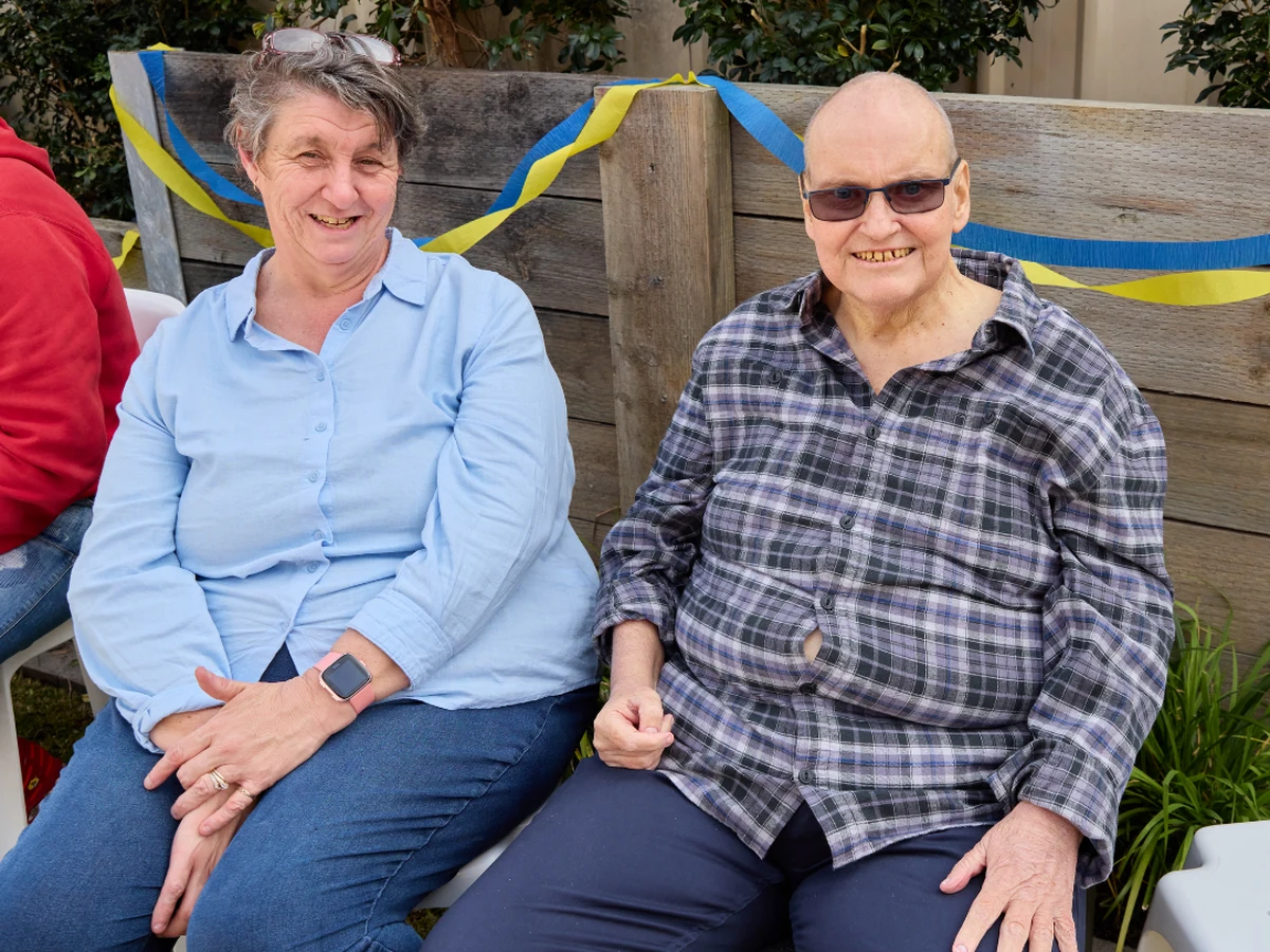 Michael and his wife Sharon sitting together at his Celebration of Life party.