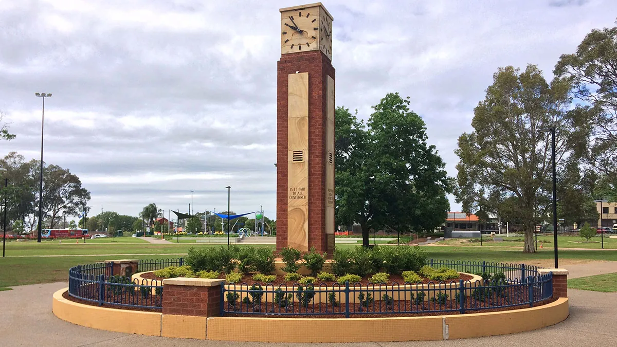 the sandstone clock tower and gardens at Bigge Park in Liverpool