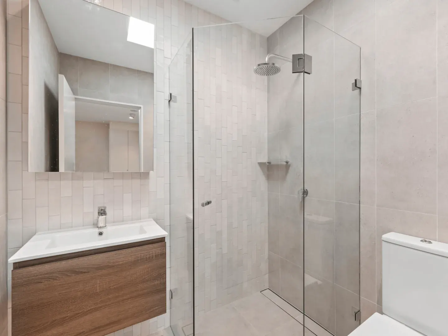 a bathroom at Erskineville with a walk in shower and a wall hung vanity