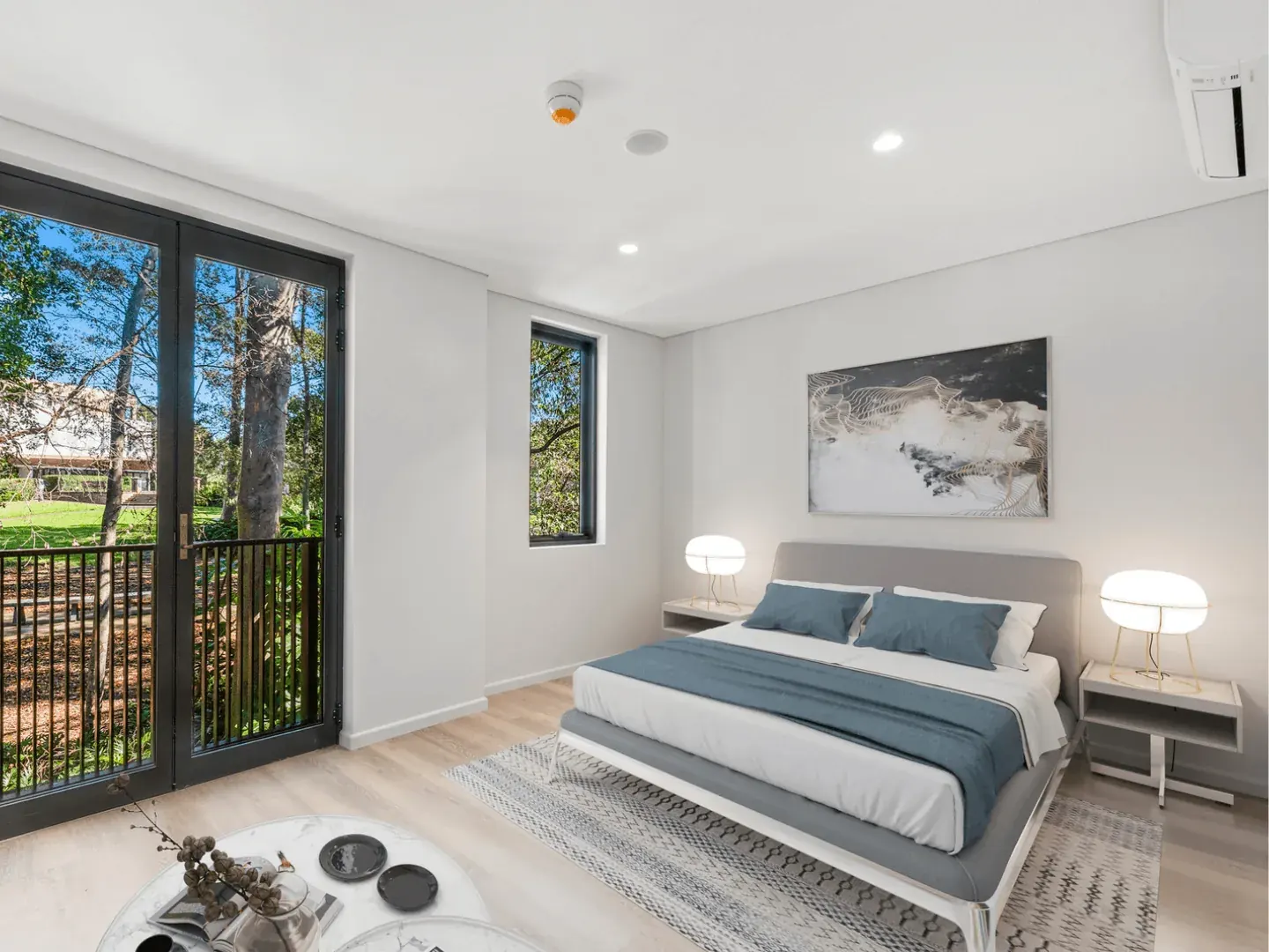 a bedroom at Erskineville with glass doors opening onto the garden