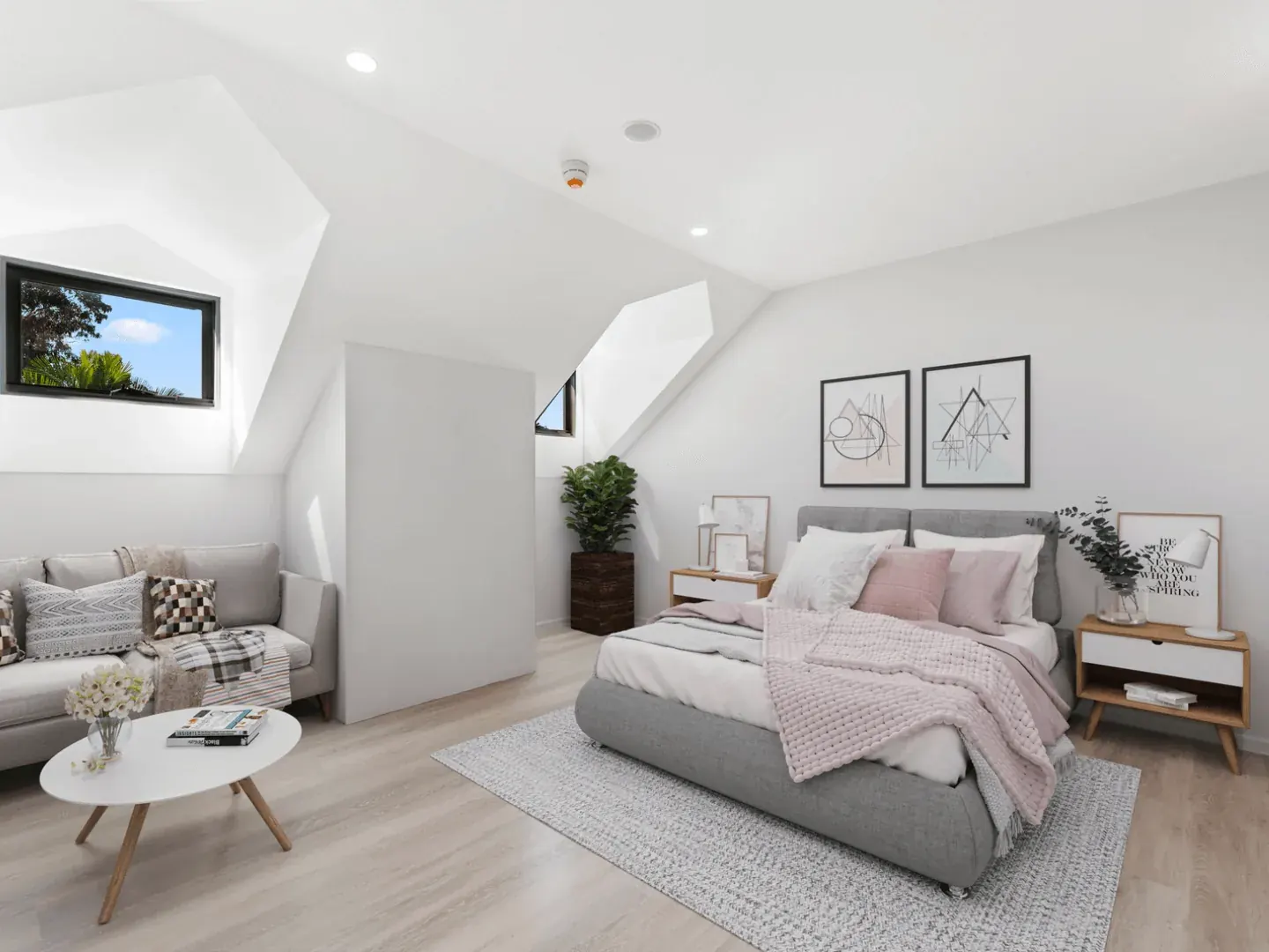 a bedroom at Erskineville set under the roofline, with its own sitting area