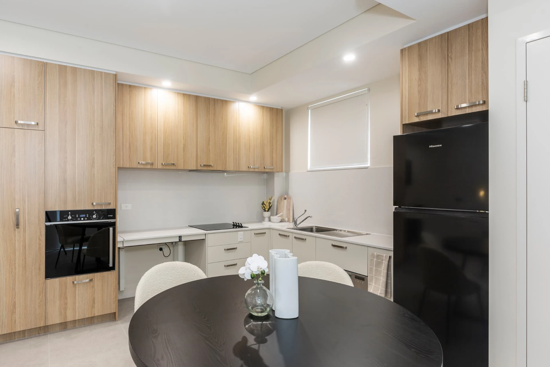 the dining and living space of an apartment at Merrylands