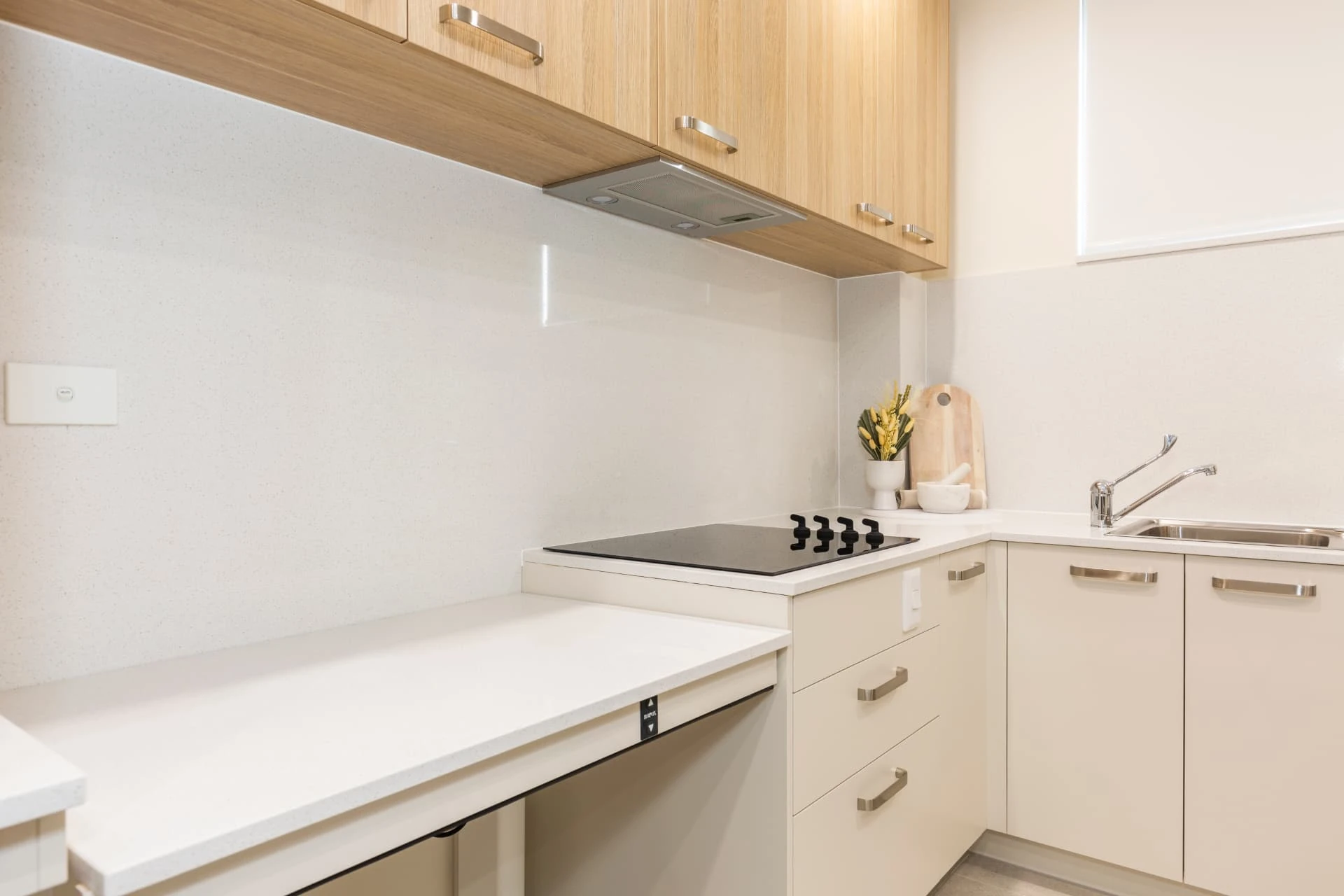 A height adjustable kitchen bench in a purpose built apartment at our Merrylands Vertical Village.
