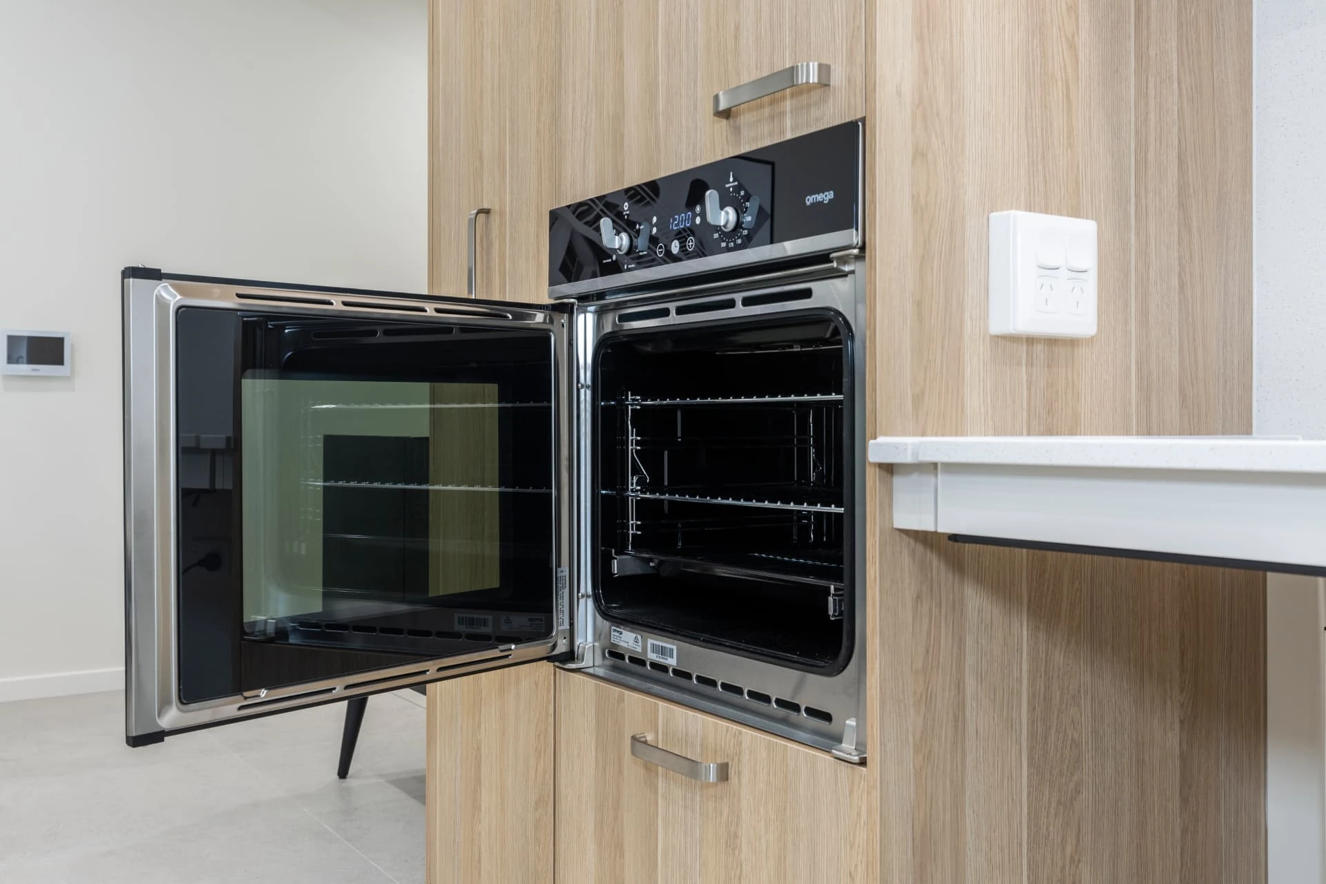 a wall oven with a side hinged door, designed for wheelchair access
