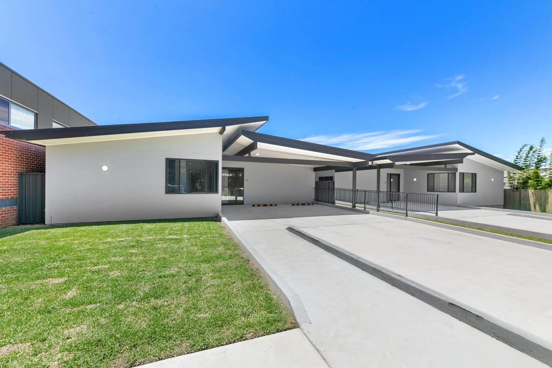 The front of our shared home at Noraville, a single storey house with an accessible path to the door.
