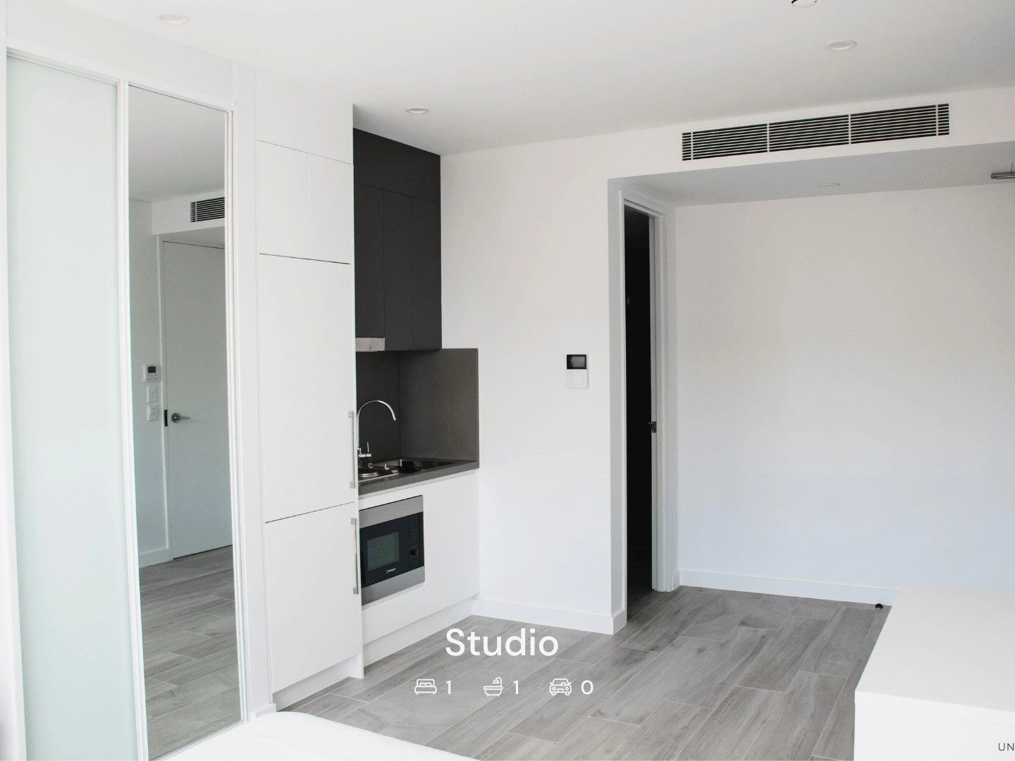 a studio apartment at Petersham with its kitchenette and hallway