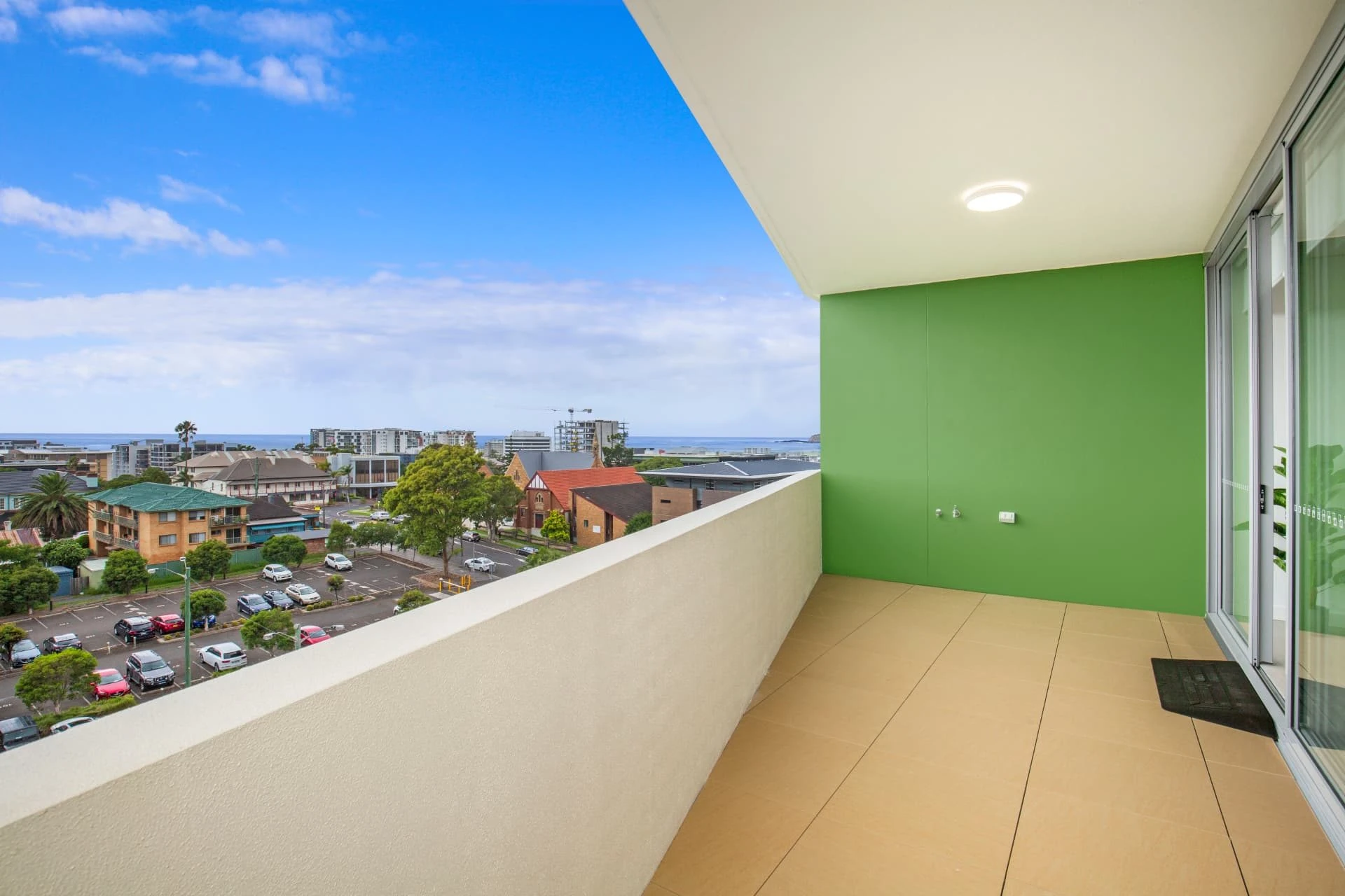 the view over Wollongong to the ocean from a village balcony