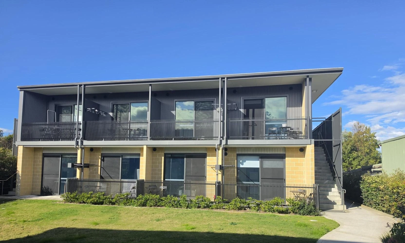 the Wyong Vertical Village on Leppington Street, with balconies overlooking the lawn